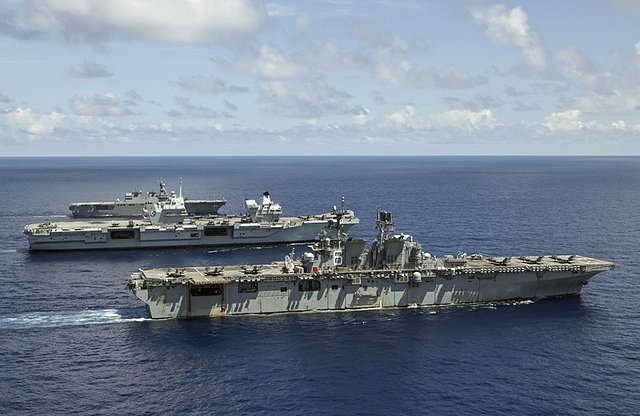 USS America (foreground) HMS Queen Elizabeth (centre) and the Japanese JS lse undertaking exercises in the Philippine Sea August 2021 pic MoD