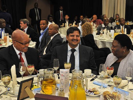 March 2012: Jacob Zuma (left) and Atul Gupta at the Gupta-owned  New Age (South African daily newspaper) breakfast in Port Elizabeth.